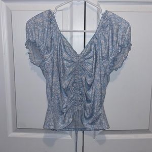 Large blue and white flower middle tie crop top.